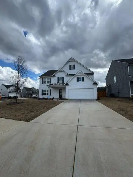 Front exterior of a new home in , Canton, GA, highlighting curb appeal (Image 1). Front exterior of a new home in , Canton, GA, highlighting curb appeal (Image 1).
