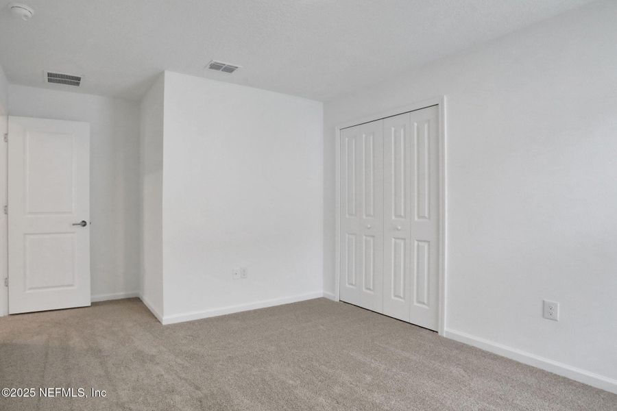 Spacious, unfurnished interior of a new home in TrailMark, St. Augustine (Image 19).