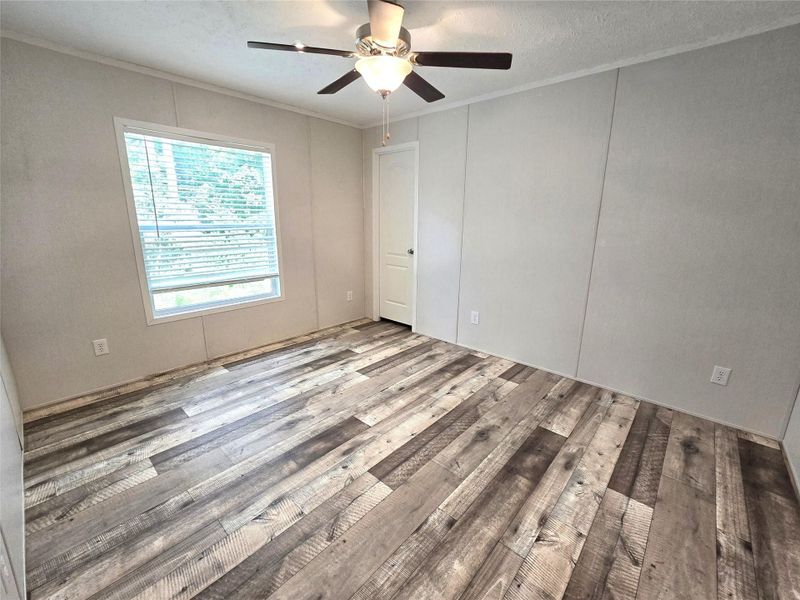 Discover the perfect blend of comfort and style in this inviting 5th bedroom, featuring modern flooring, ample natural light, and a sleek ceiling fan. Discover the perfect blend of comfort and style in this inviting 5th bedroom, featuring modern flooring, ample natural light, and a sleek ceiling fan.