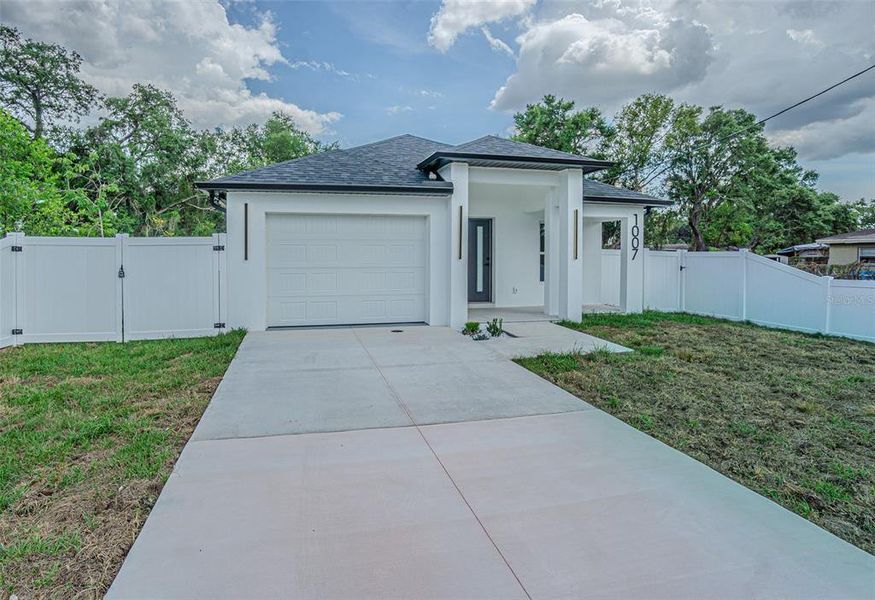 Front exterior of a new home in , Tampa, FL, highlighting curb appeal (Image 14).