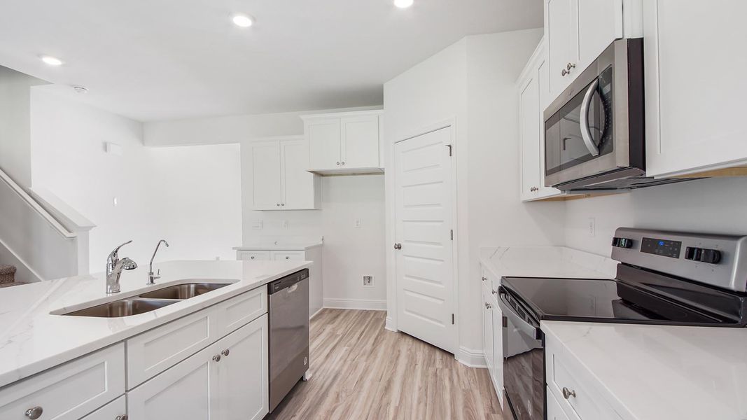 Representative unfurnished interior of a home built from the Carol by D.R. Horton in Holley Grove at Peach Creek, Santa Rosa Beach (Image 12).