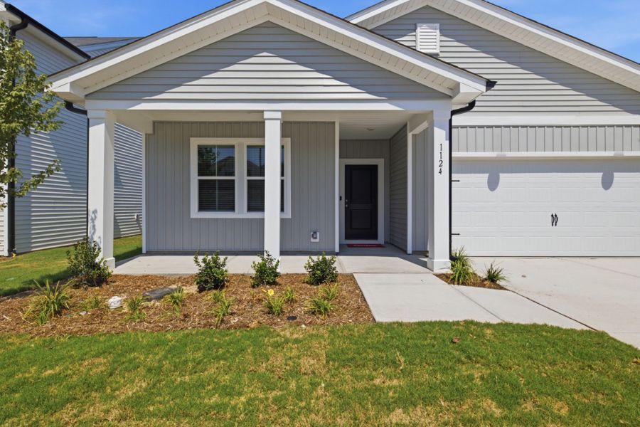 Exterior details and patio area of a home in Carpenter Falls, Durham (Image 4).