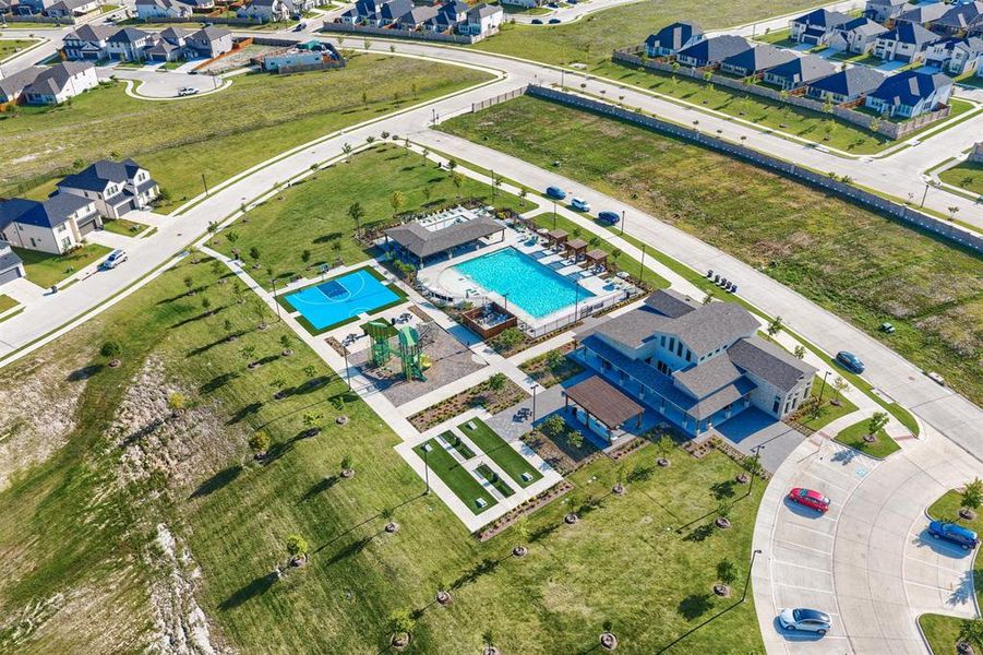 Aerial perspective of suburban area with a pool area Aerial perspective of suburban area with a pool area