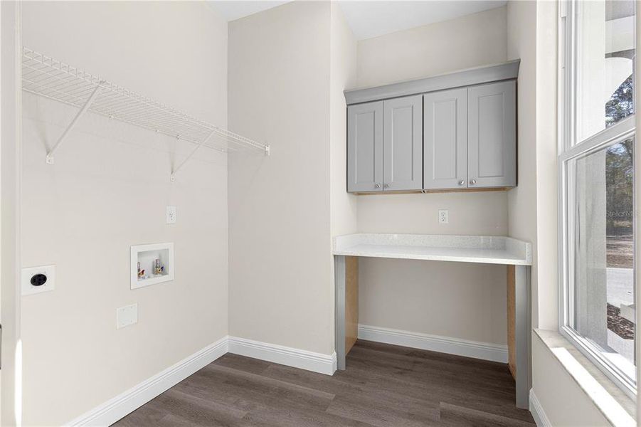 OVERSIZED LAUNDRY ROOM WITH WINDOW OVERLOOKING THE FRONT YARD