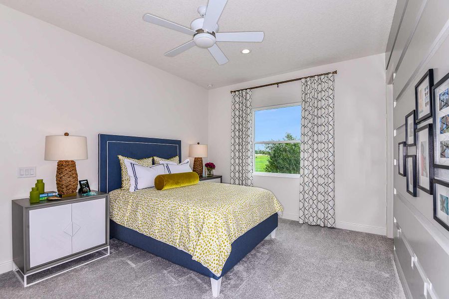 Representative furnished interior of a home built from the Savannah 2 by Neal Communities in SkySail, Naples (Image 13).