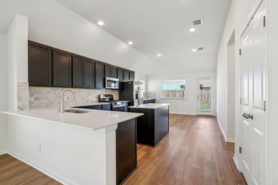 Furnished interior view inside a new home in Village at Three Oaks, Seguin (Image 7).