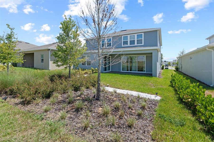 Front exterior of a new home in , Montverde, FL, highlighting curb appeal (Image 2).