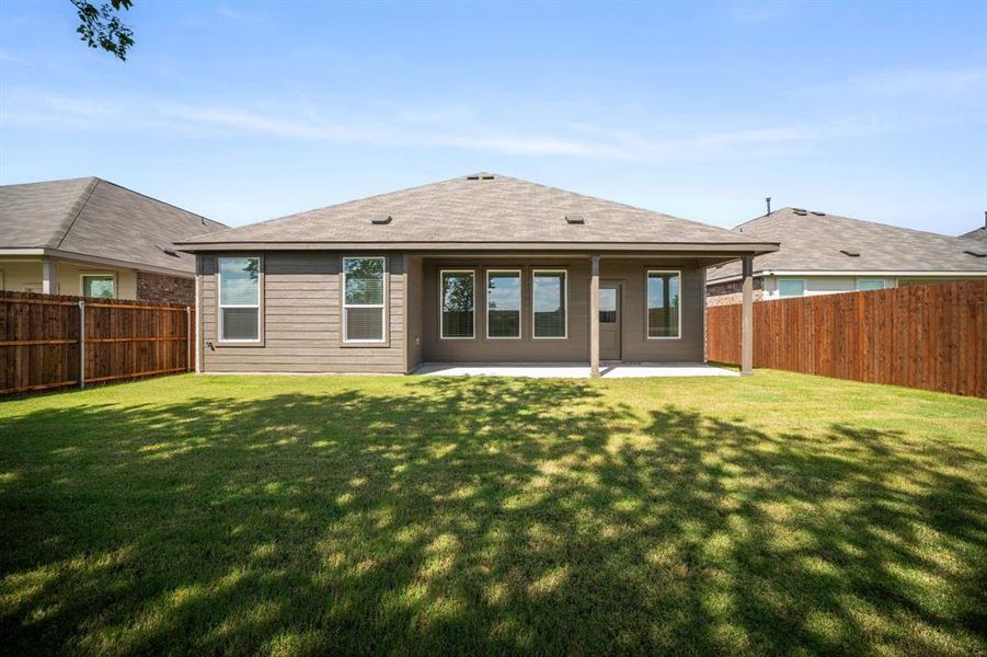 Exterior details and patio area of a home in Prairie View, Ennis (Image 18). Exterior details and patio area of a home in Prairie View, Ennis (Image 18).
