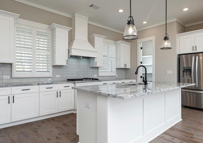 Sprawling granite countertops in the kitchen.