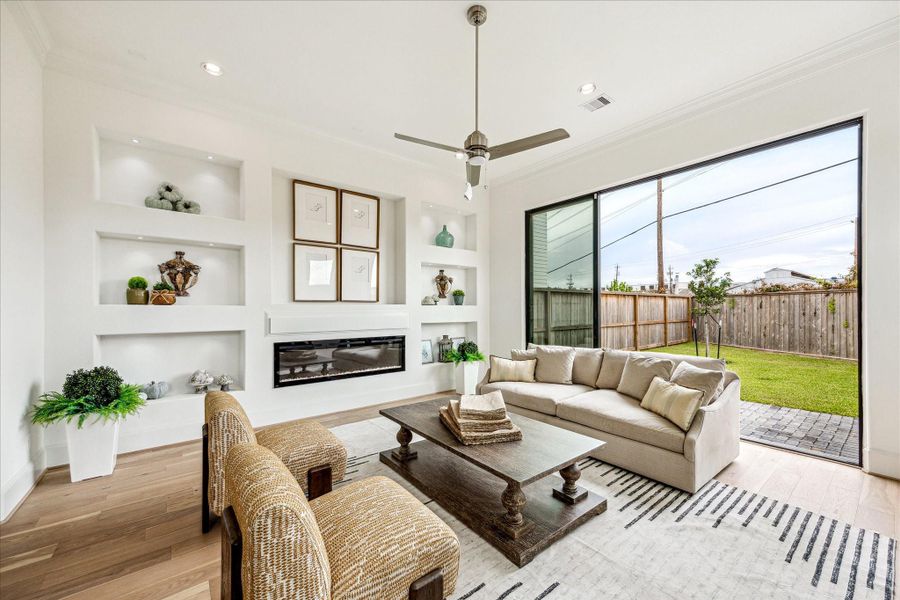 gorgeous builtins in living room with electric fireplace