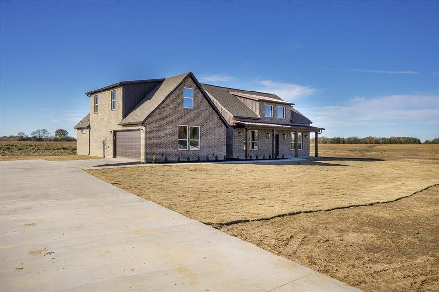 Front exterior of a new home in , Brashear, TX, highlighting curb appeal (Image 22).