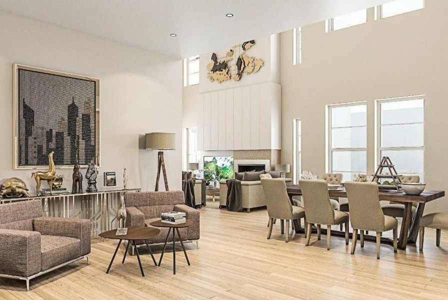 Dining area featuring light wood-type flooring, a high ceiling, and a fireplace Dining area featuring light wood-type flooring, a high ceiling, and a fireplace