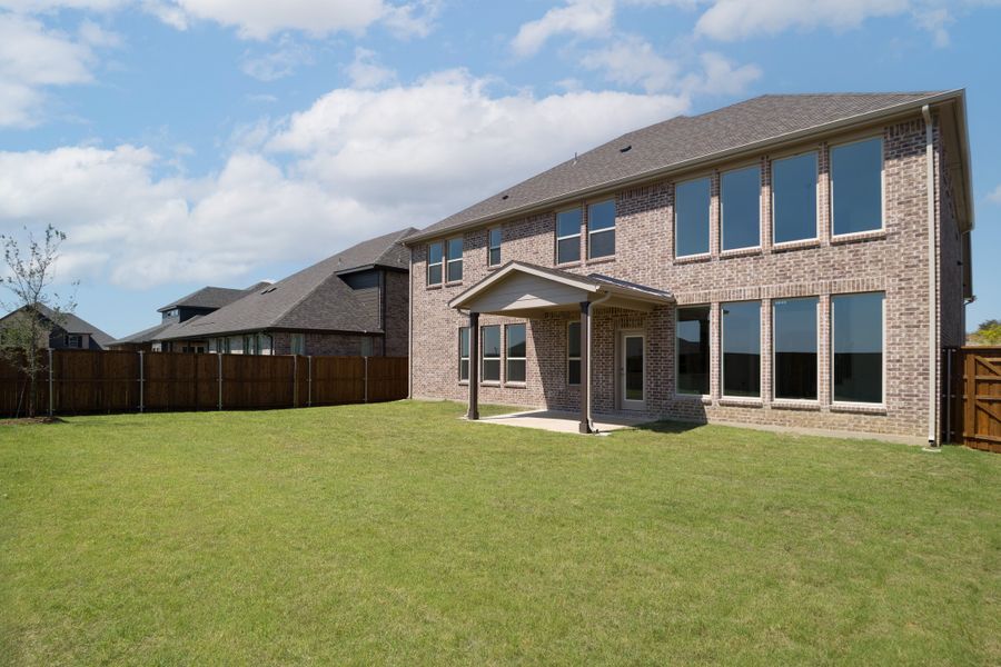 Exterior details and patio area of a home in Enclave at Legacy Hills, Celina (Image 3).