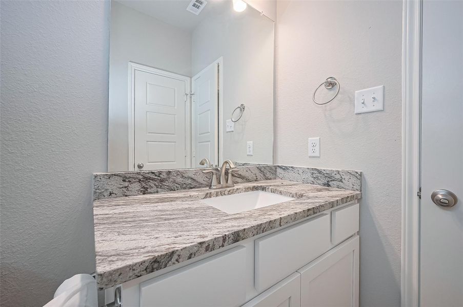 Furnished interior view inside a new home in Sunterra, Katy (Image 10).