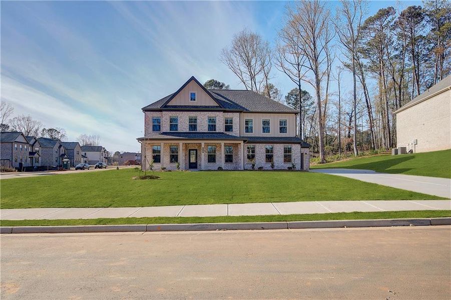 Front exterior of a new home in Trinity Park, McDonough, GA, highlighting curb appeal (Image 19).