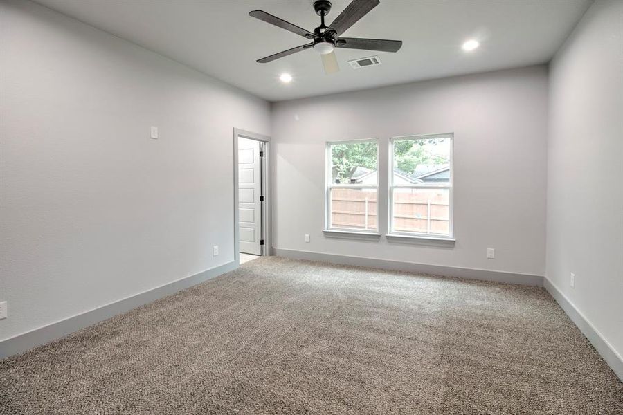 Empty room featuring carpet floors, recessed lighting, and ceiling fan Empty room featuring carpet floors, recessed lighting, and ceiling fan