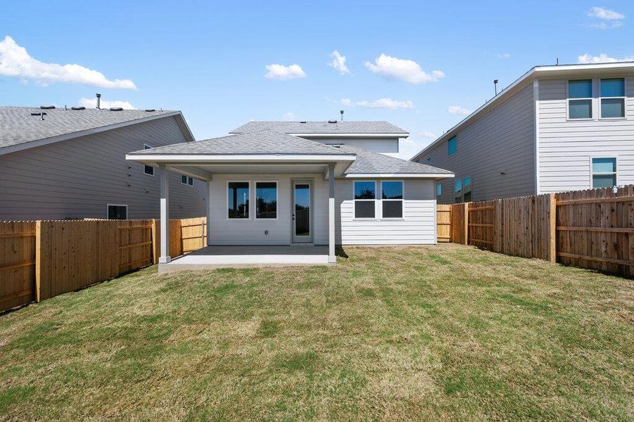 Exterior details and patio area of a home in Cannon Ranch, Dripping Springs (Image 26).