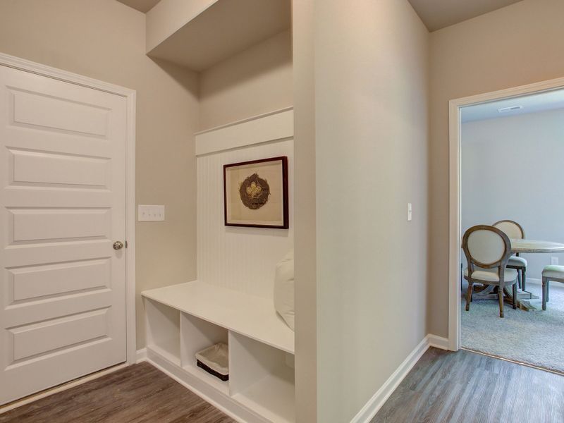 Mud room with optional bench located off of garage area