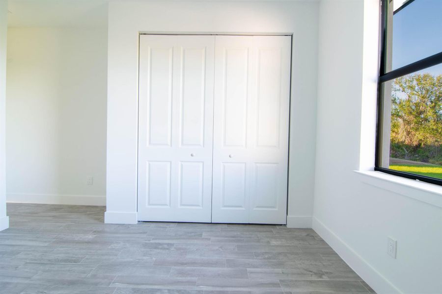 Spacious, unfurnished interior of a new home in , Port Charlotte (Image 24).