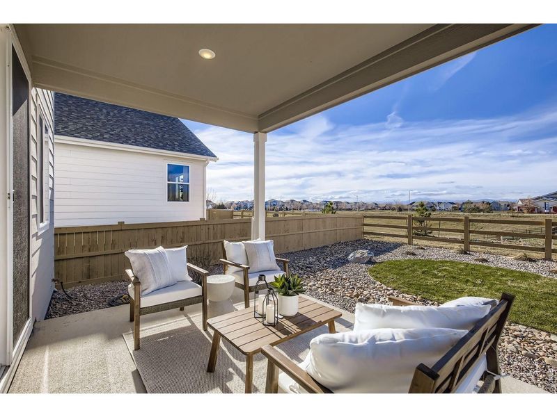Exterior details and patio area of a home in Farmstead, Berthoud (Image 22).