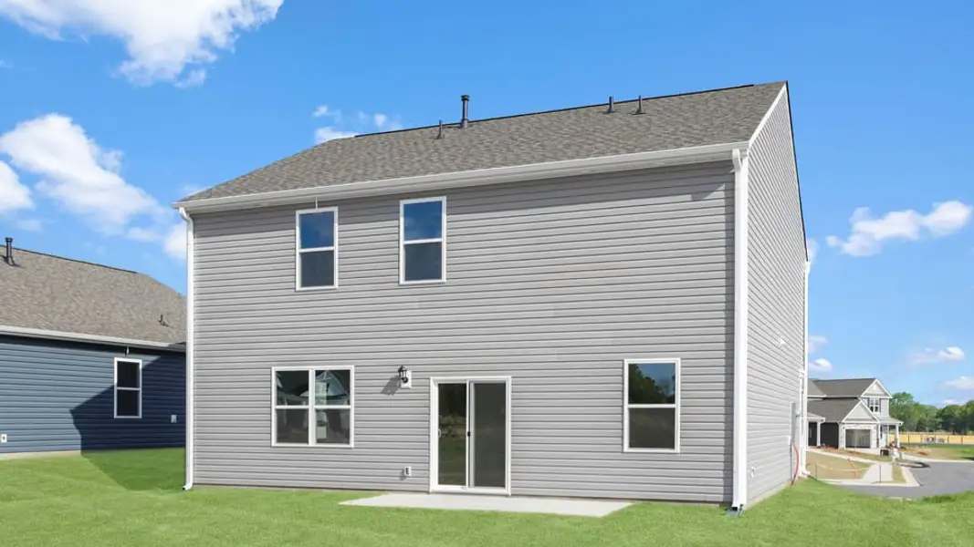 Exterior details and patio area of a home in Durbin Meadows Traditions, Fountain Inn (Image 4).