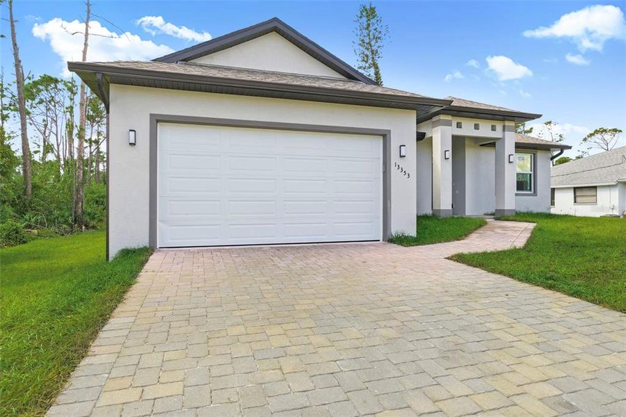 Front exterior of a new home in , Port Charlotte, FL, highlighting curb appeal (Image 1). Front exterior of a new home in , Port Charlotte, FL, highlighting curb appeal (Image 1).