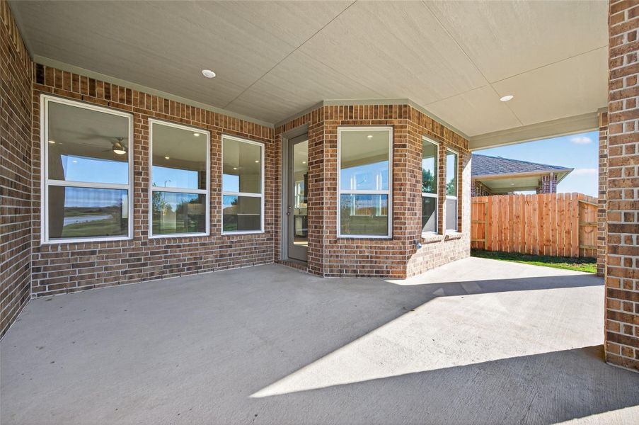 The covered patio offers the perfect outdoor retreat, ideal for relaxing or entertaining guests. Its spacious design and private fenced yard make it a great extension of the home’s living space.