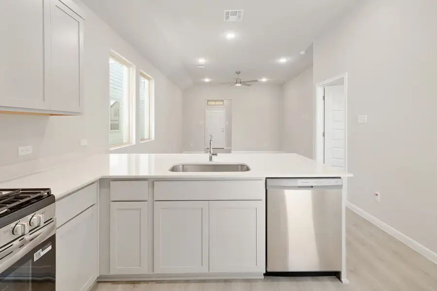 Kitchen in the Ash home plan by Trophy Signature Homes – REPRESENTATIVE PHOTO