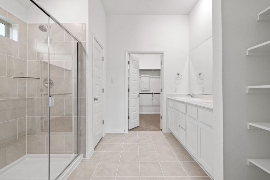 Primary Bathroom in the Quartz home plan by Trophy Signature Homes – REPRESENTATIVE PHOTO