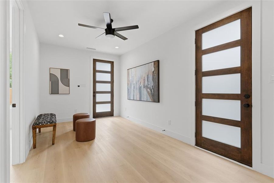 Light-toned wood-finish flooring complements white walls Light-toned wood-finish flooring complements white walls