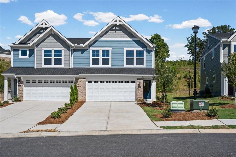 Front exterior of a new home in Villas at Gold Creek, Dawsonville, GA, highlighting curb appeal (Image 20). Front exterior of a new home in Villas at Gold Creek, Dawsonville, GA, highlighting curb appeal (Image 20).