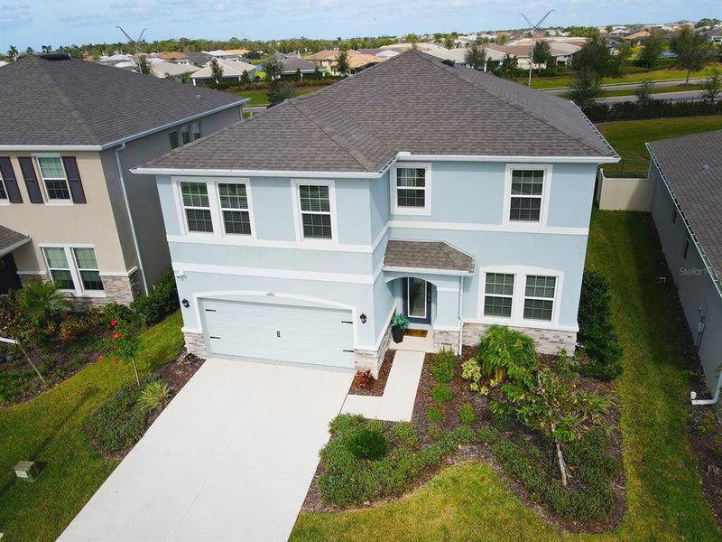 Front exterior of a new home in Solera at Lakewood Ranch, Lakewood Ranch, FL, highlighting curb appeal (Image 27).