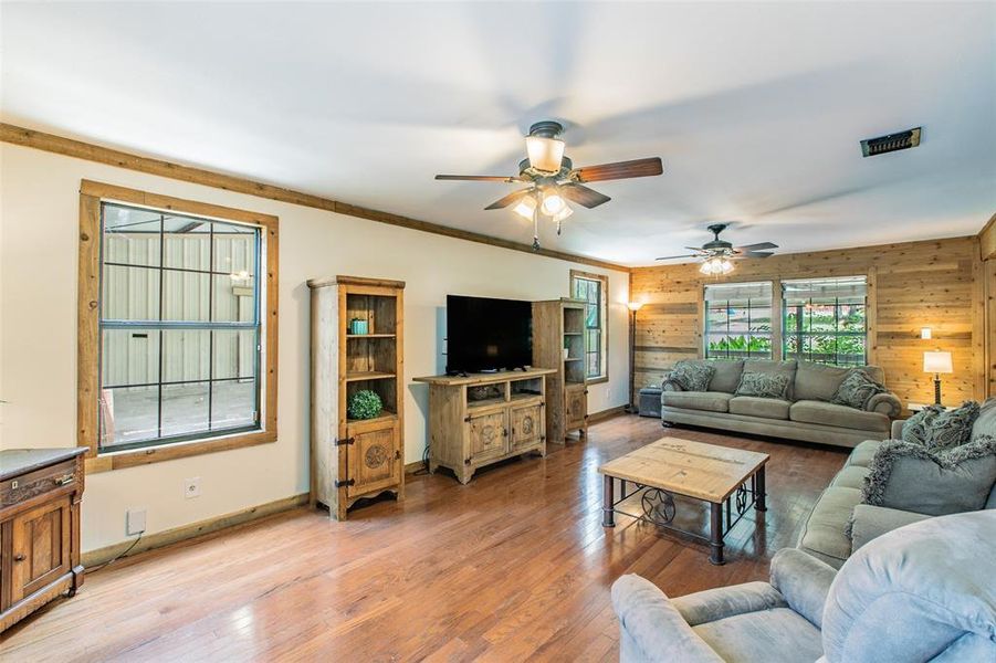 Expansive living room with rustic finishes and plenty of space for relaxing or entertaining. Expansive living room with rustic finishes and plenty of space for relaxing or entertaining.