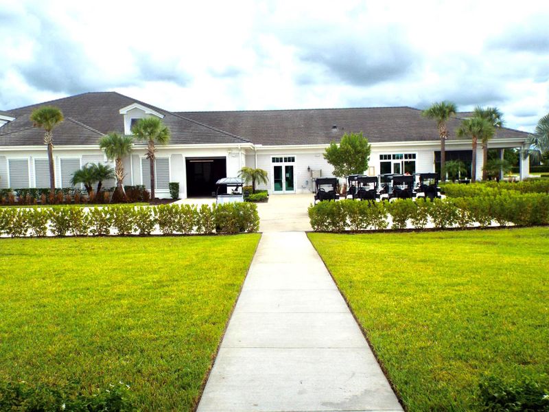 Front exterior of a new home in , Ave Maria, FL, highlighting curb appeal (Image 18).