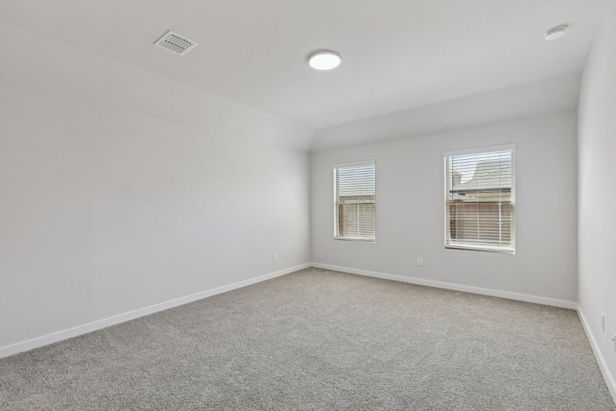 Primary Suite in the Harrison home plan by Trophy Signature Homes – REPRESENTATIVE PHOTO