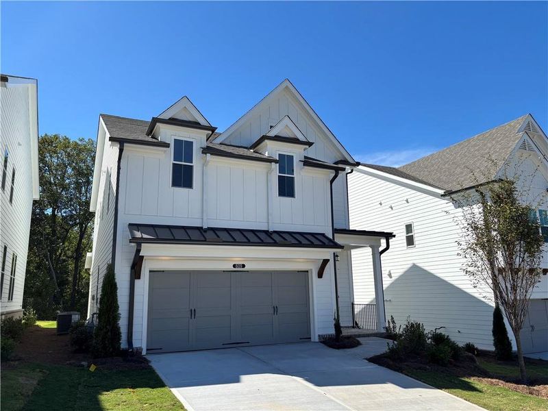 Front exterior of a new home in Palisades Single Family, Cumming, GA, highlighting curb appeal (Image 18).