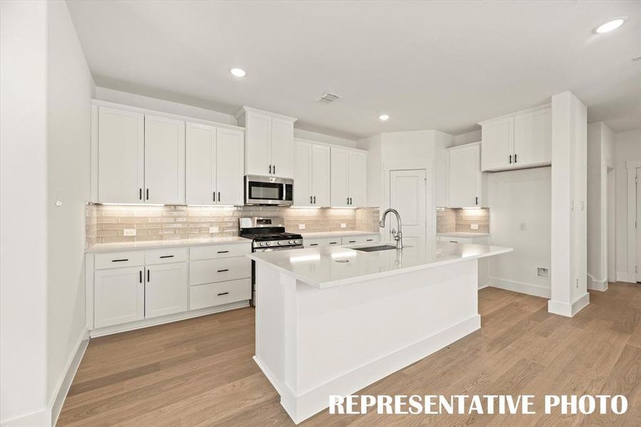 No shortage of storage space, prep space or style in this fabulous kitchen!  REPRESENTATIVE PHOTO