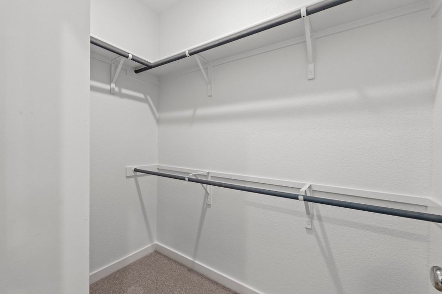 Primary Closet in the Pearl home plan by Trophy Signature Homes – REPRESENTATIVE PHOTO