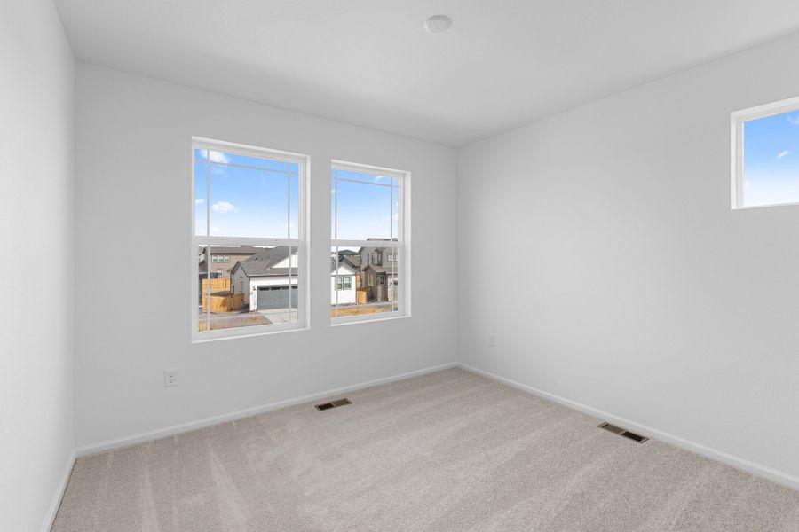 Spacious, unfurnished interior of a new home in The Cottages Collection at Ridgeline Vista, Brighton (Image 17).