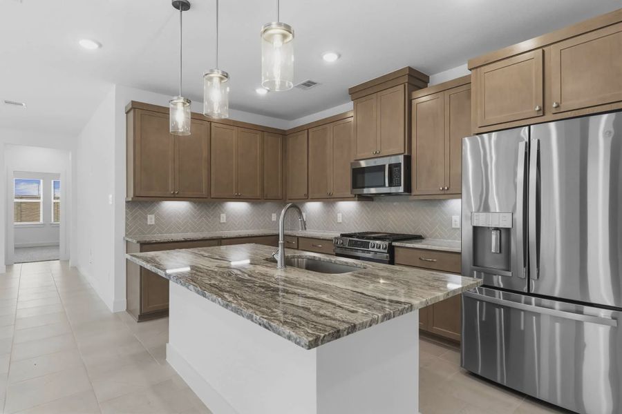 Representative furnished interior of a home built from the Carriagehouse by Chesmar Homes in Meridiana Townhomes, Iowa Colony (Image 10).