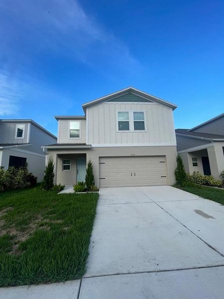 Front exterior of a new home in Pasadena Point, Wesley Chapel, FL, highlighting curb appeal (Image 2). Front exterior of a new home in Pasadena Point, Wesley Chapel, FL, highlighting curb appeal (Image 2).
