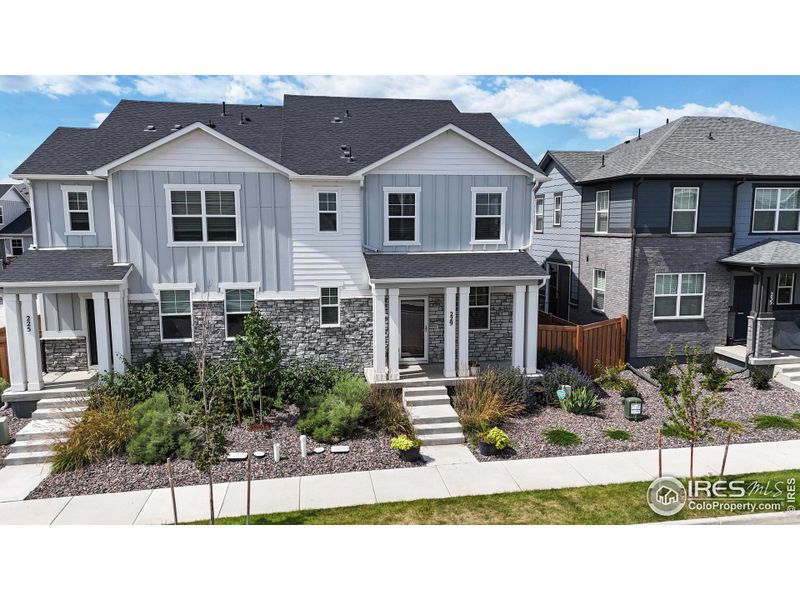 Front exterior of a new home in Fickel Farms, Berthoud, CO, highlighting curb appeal (Image 19).