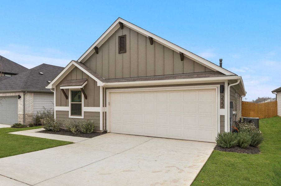 Front exterior of a new home in Trinity Ranch, Elgin, TX, highlighting curb appeal (Image 23).