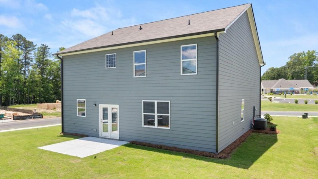 Exterior details and patio area of a home in Northwoods at Mirror Lake, Villa Rica (Image 3).