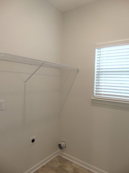 The laundry room with a rack for all your laundry detergents