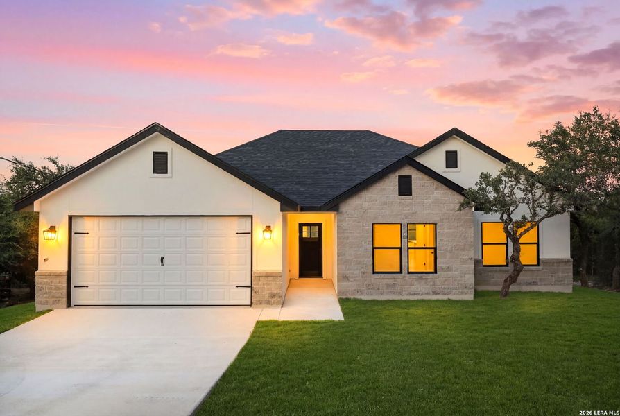 Front exterior of a new home in , Canyon Lake, TX, highlighting curb appeal (Image 24). Front exterior of a new home in , Canyon Lake, TX, highlighting curb appeal (Image 24).