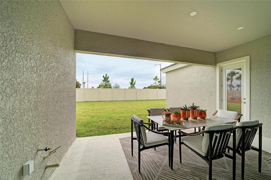 Exterior details and patio area of a home in Oakfield, Parrish (Image 26).