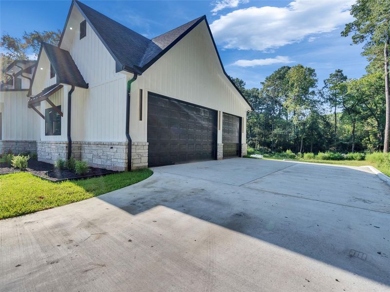 Front exterior of a new home in , Magnolia, TX, highlighting curb appeal (Image 1).