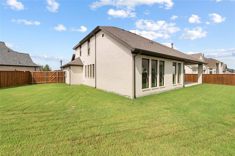 Front exterior of a new home in The Lakes Of Somercrest 60', Midlothian, TX, highlighting curb appeal (Image 20). Front exterior of a new home in The Lakes Of Somercrest 60', Midlothian, TX, highlighting curb appeal (Image 20).