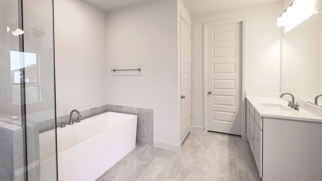 Furnished interior view inside a new home in 6 Creeks 50', Kyle (Image 9).